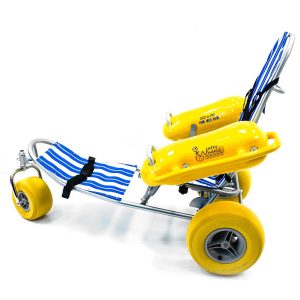 Beach wheelchair with wide balloon wheels on the sand